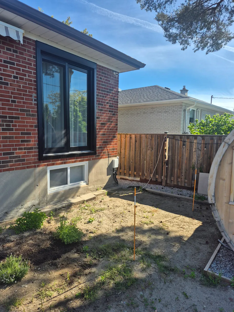 Patio door installed in the brick wall, before the deck was built.