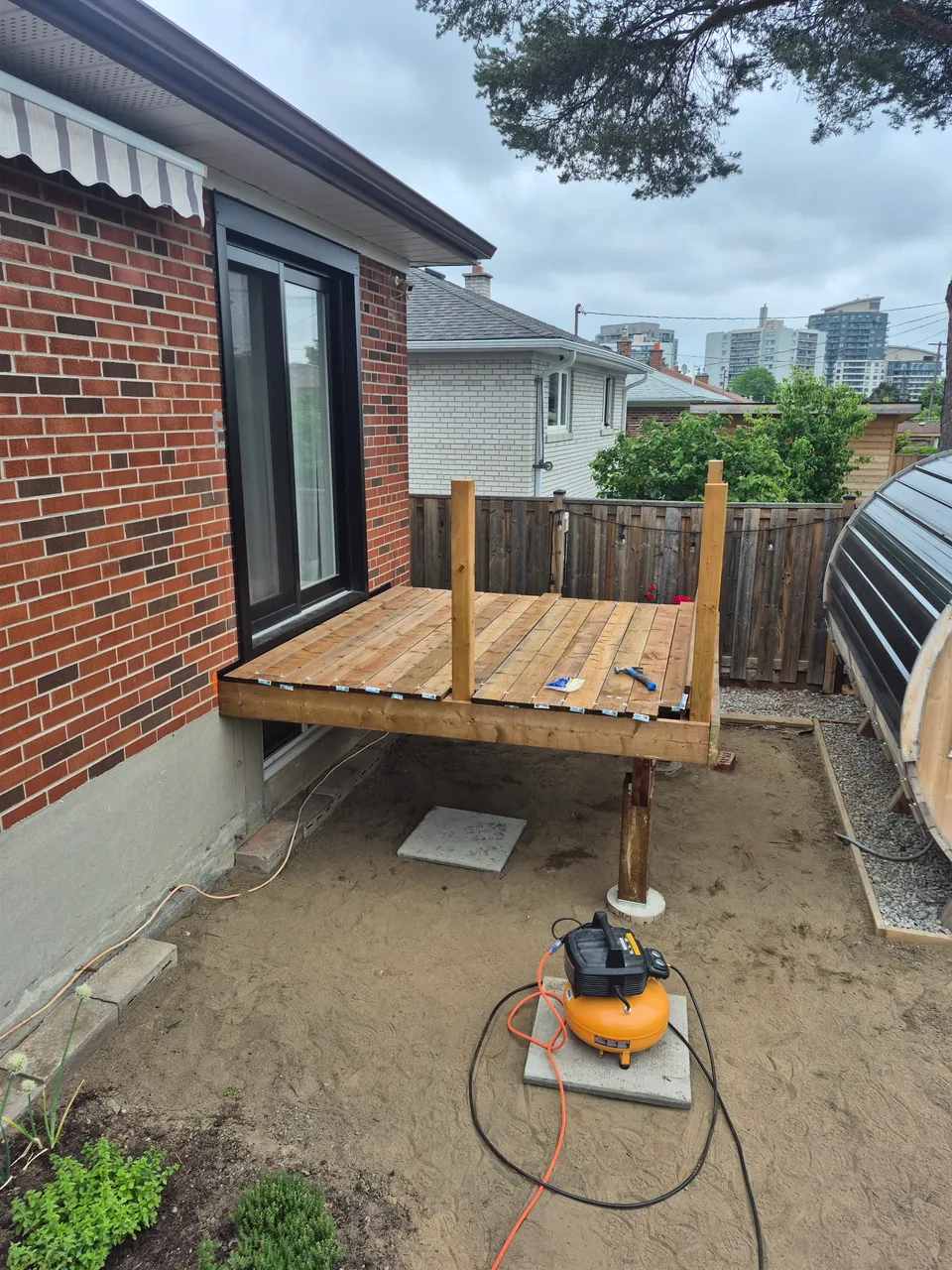 Deck boards installed, with railings and stairs still to be added.