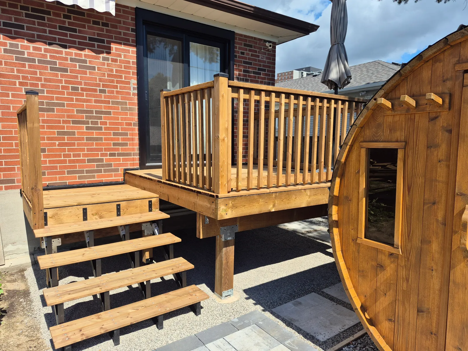 An alternative view of the completed timber deck, stairs and patio door.